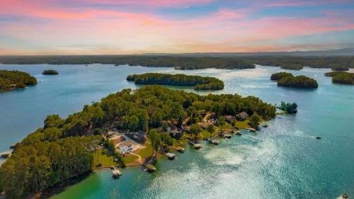 an aerial view of an island in a body of water at DockTales - Panoramic Views & Private Dock in Six Mile