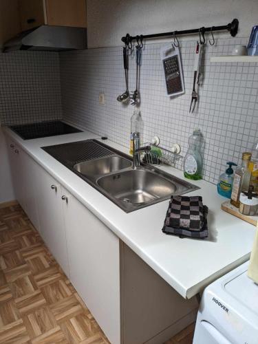 Kuchyň nebo kuchyňský kout v ubytování Joli Duplex