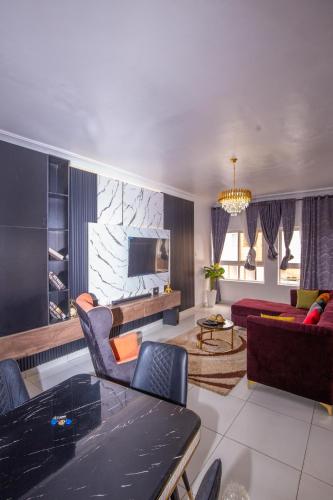 a living room with a couch and a table at 2 Bedroom Furnished Serviced Apartment in Lekki Phase 1 in Lekki