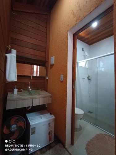 a bathroom with a sink and a toilet and a shower at Aqui no Camping in Brumadinho