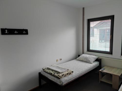 Postel nebo postele na pokoji v ubytování Mico NP Guest House