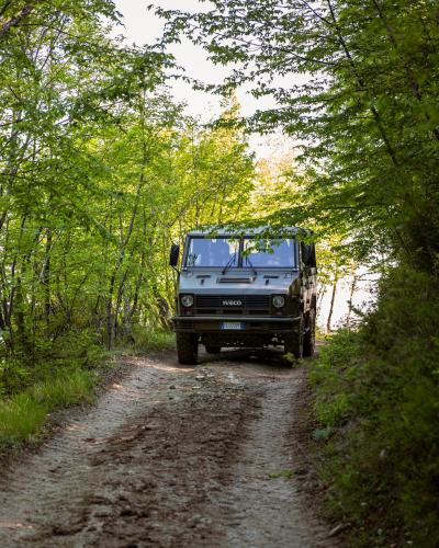 a jeep is parked on a dirt road at Tenuta Borgo Santa Cecilia in Gubbio