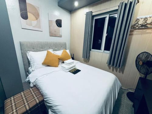 Ένα ή περισσότερα κρεβάτια σε δωμάτιο στο Smart Stay 2600 - Solo Condo Studio Units