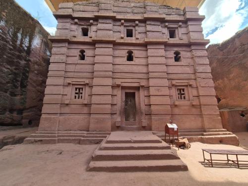 a stone building with steps leading up to it at Halle Hotel - Lalibela in Lalībela