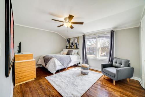 a bedroom with a bed and a ceiling fan at 2 Mi to Calumet Park and Beach Windy City Escape! in Chicago