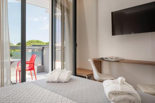 Et tv og/eller underholdning på Riccione Beach Hotel-Vero'Boutique Hotel-