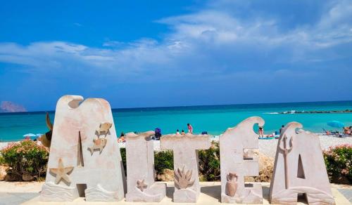 a sign on the beach in front of the ocean at TAJ house center altea #1 in Altea