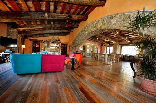 a large living room with a table and chairs at Luxury villa Colle dell'Asinello ,proprietari ,Villa In esclusiva near ORVIETO in Guardea