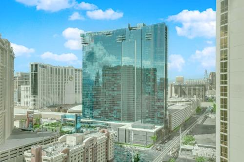a view of a large glass building in a city at Mirai MGM Signature in Las Vegas