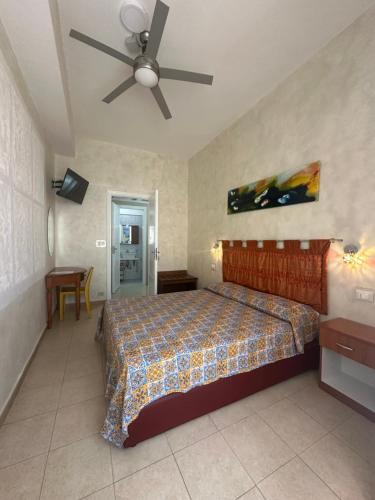 Ένα ή περισσότερα κρεβάτια σε δωμάτιο στο Bed & Breakfast Delle Palme