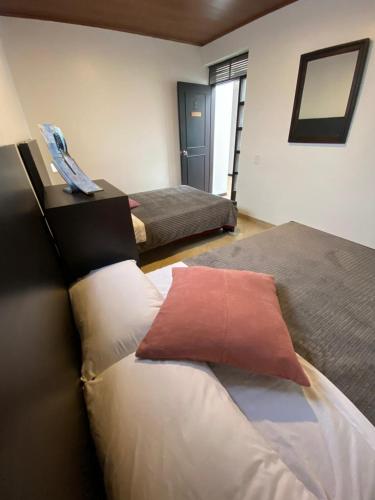Cama o camas de una habitación en Destino Nómada Calle 11 n 1-38