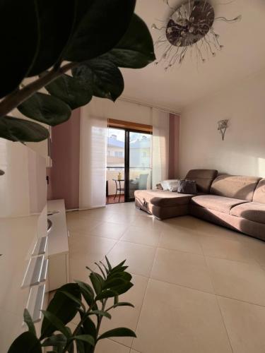 a living room with a couch and a table at Casa Sam Lagos in Lagos