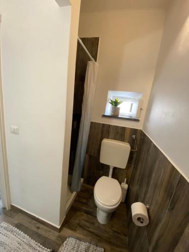 a small bathroom with a toilet and a sink at Lipari Centro Storico 5 mins from port Casa Celeste in Lipari