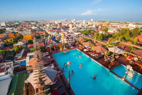 an overhead view of a large swimming pool in a city at Okay Boutique Hotel in Phnom Penh