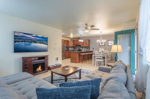 a living room with a couch and a fireplace at Walk to Downtown Leavenworth * Sleeps 6 + Pets * Ground Level Gem! in Leavenworth