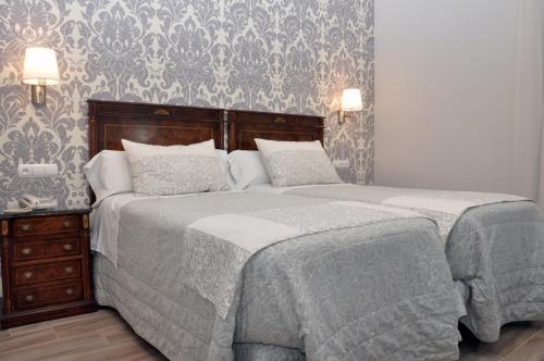 Postel nebo postele na pokoji v ubytování Hotel Selu