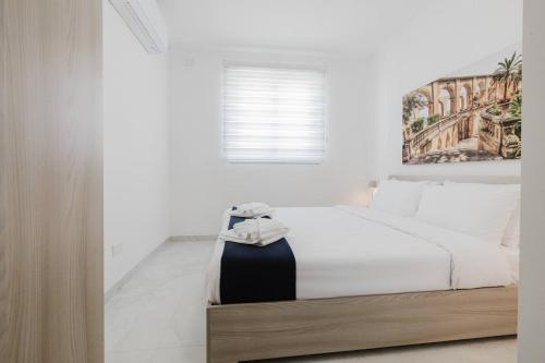 Postel nebo postele na pokoji v ubytování Ruby Residence Fl8 By Homely Malta!
