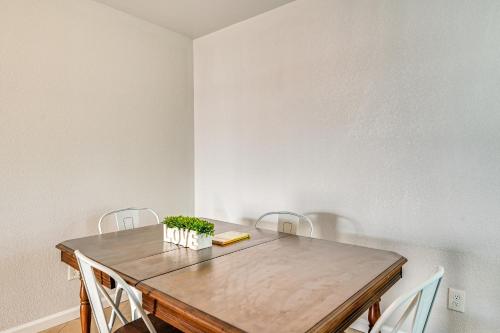 a dining room with a wooden table and chairs at Walk to Town Home with Yard in Brenham! in Brenham