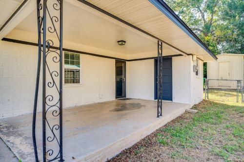 an empty porch of a house with a iron gate at Walk to Town Home with Yard in Brenham! in Brenham