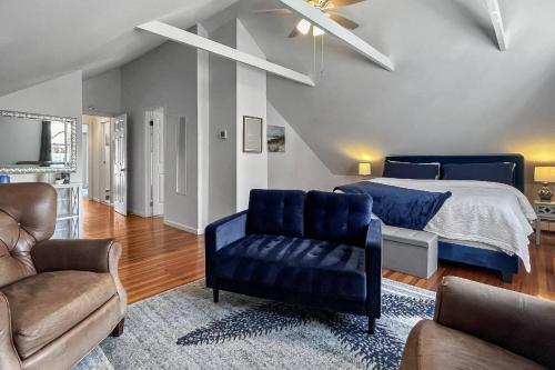 a bedroom with a bed and a couch and a chair at Grove Place Beach West Haven in West Haven