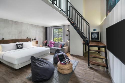 Postel nebo postele na pokoji v ubytování MOXY Bandung