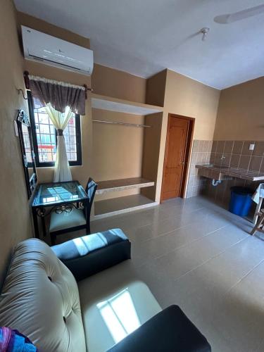a living room with a couch and a table at Hostal Rosy in Valladolid