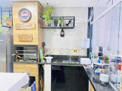 a kitchen with a sink and a counter top at Espaço Varanda in Sao Paulo