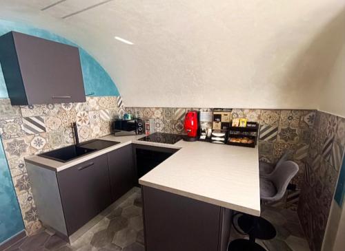 a kitchen with a sink and a counter top at La grotta in Procida