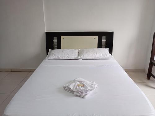 Postel nebo postele na pokoji v ubytování HOTEL MALU REAL POPAYAN Cauca