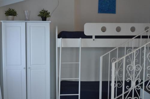 a bedroom with a bunk bed and a staircase at Residence Le Terrazze in Sorrento