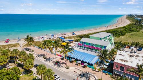 an aerial view of a beach and a building at Standard Hotel Room - King Bed #2 in Fort Pierce