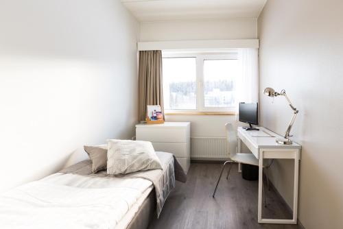 Postel nebo postele na pokoji v ubytování Finlandia Hotel Alba