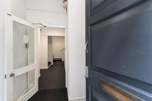 a door leading to a hallway with a hallwaygue at WhiskAwayHomes - Jenkins House - Studio 2 in Worcester