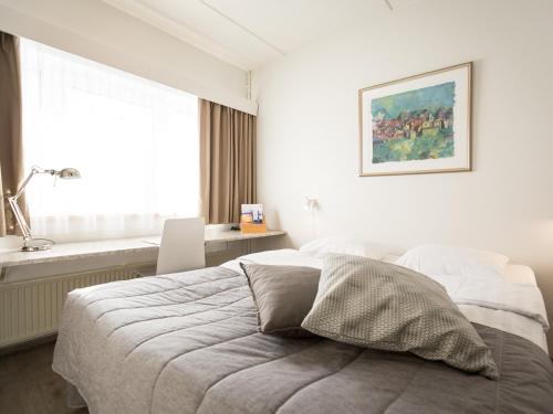 Postel nebo postele na pokoji v ubytování Finlandia Hotel Alba