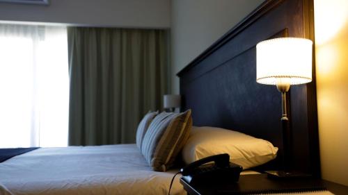 Ein Bett oder Betten in einem Zimmer der Unterkunft Howard Johnson Chascomus