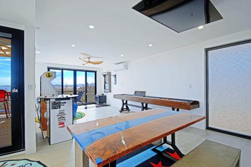 a room with a ping pong table in it at 20-30 Knots- 5br4ba Game Night Villa Hot Tub in El Sargento