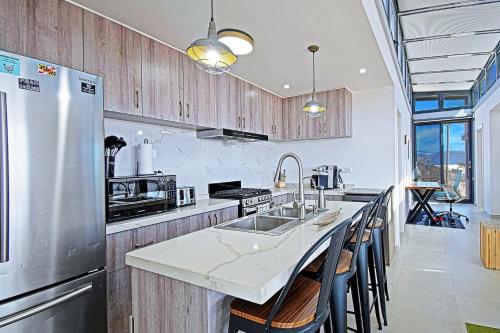 a kitchen with a stainless steel refrigerator and a counter at 20-30 Knots- 5br4ba Game Night Villa Hot Tub in El Sargento