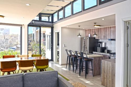 an open kitchen and dining room with a table and chairs at 20-30 Knots- 5br4ba Game Night Villa Hot Tub in El Sargento