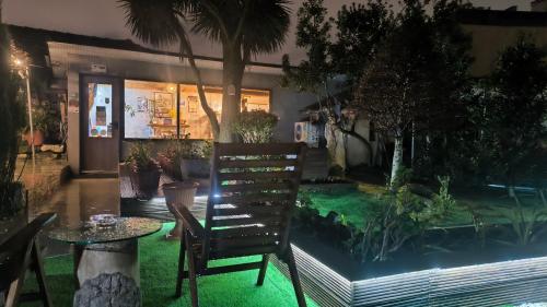 a patio with a table and a fish tank at Ruby Charm Houses in Porto