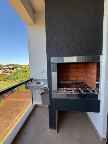 a kitchen with a stove top oven in a room at Departamento con vistas al rio in Encarnación