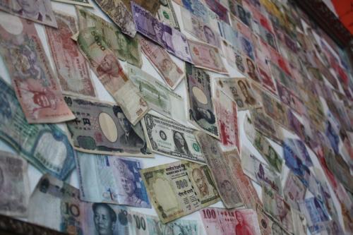 a wall filled with lots of money dollar bills at Andong Poong-gyung HOSTEL n LIBRARY in Andong