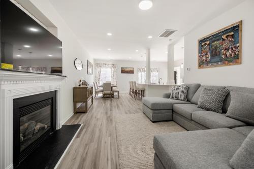 a living room with a couch and a fireplace at The Secret Nook in Charlotte