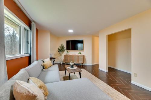 a living room with a couch and a tv at The Dome' - Spacious Retreat Near Finger Lakes! in Penn Yan