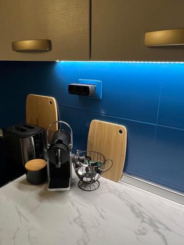 a kitchen counter with a coffee maker on a table at Tropical Morna in Santa Maria