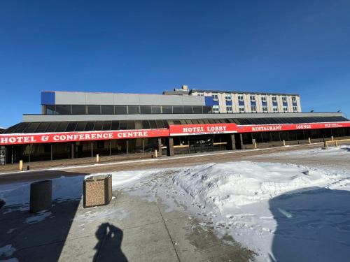 a shadow of a dog standing in front of a convention center at The Lodge Inn in Edmonton
