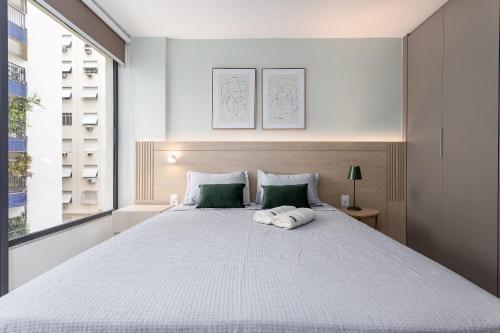 Ένα ή περισσότερα κρεβάτια σε δωμάτιο στο Apt Aconchegante | Piscina, Sauna e Metrô 350m