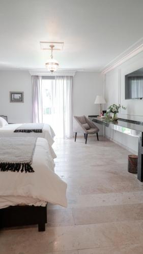 Postel nebo postele na pokoji v ubytování Hotel Alameda Grand