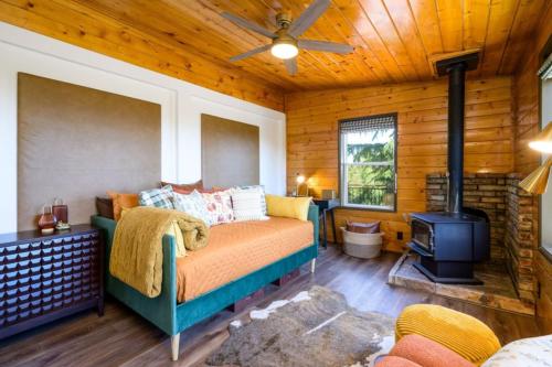 a bedroom with a bed and a stove at Breathtaking Views Elevated Comfort Pets Welcome in Prescott
