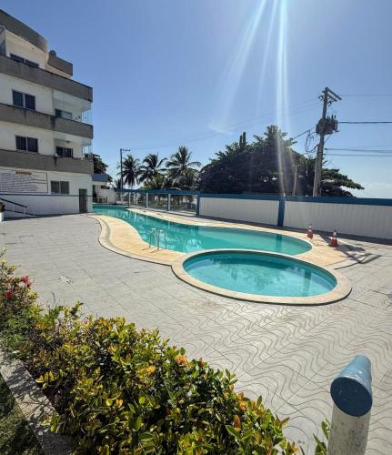 Bazén v ubytování Apt 103 Térreo Frente Para o Mar e Piscina Village das Ondas nebo v jeho okolí