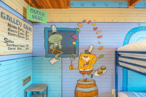a room with a cartoon character in a mirror at Lux Lakeside Escape Slps 20 with Pool, Golf Sim, Hot Tub, Karaoke, Gym and Sauna in Peterborough